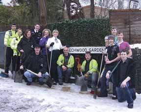 Members of Tandridge’s Safer Neighbourhood Team with residents of Beechwood Gardens, Caterham.