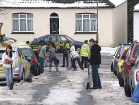 Residents and police clear the ice from Beechwood Gardens