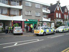 Police outside the Post Office in the High Street, Caterham-on-the-Hill.