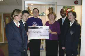 From left to right: Rebecca Geeson (Year 10), Alex Limpenny (Year 8), Louise Fern, Great Ormond Street Hospital, Alison Woodhouse, Warlingham School Headteacher, Ron Mugga, Warlingham School's International Schools Co-ordinator and Ella Fadden (Year 10).