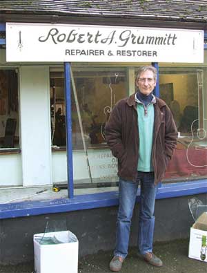 Robert Grummitt outside his shop in the High Street, Caterham-on-the- Hill.