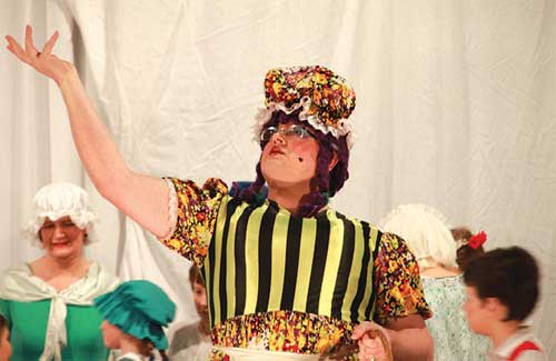 Simon Kelly as panto dame, 'Miss Givings'. Photo by Jon Harrison