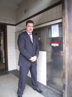 Andrew Browne by the sealed off post box in the Station Avenue post office entrance lobby.