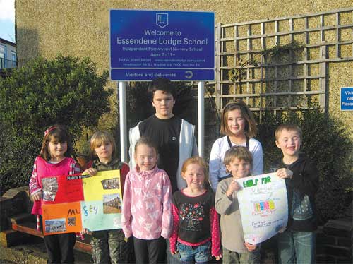 Essendene schoolchildren on Home Clothes Day displaying their colourful posters