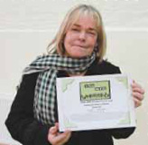 Linda Robson with her share certificate (Photo by Jon Harrison)