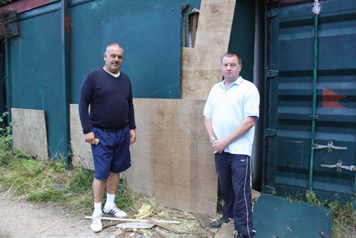 Under 13s manager, Kevin Arney, left and Caterham Pumas Chairman, Kevin Savage by the hut that has been temporarily secured following the break-in.