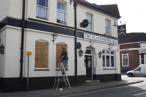 The Blacksmith's Arms being boarded up yesterday.