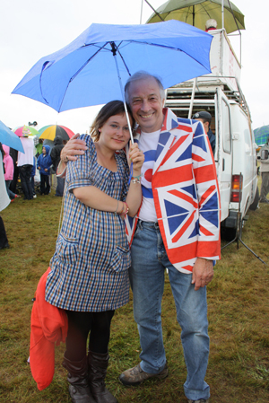 Brollies Up!  Chairman of the Kenley Air Day 2010 Organising Committee, Mike Street, sheltering from a shower with his friend Emma Burry.