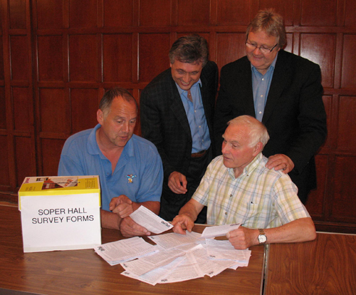 The photograph shows Soper Hall Group members studying the first batch of responses to the Survey.  From left, Andy Parr, Random Greenway, Graham Tapley (Soper Hall Group Chairman) and, seated, Terry Servant (Vice-Chairman). 