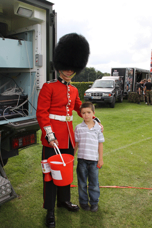 Six year-old Santir O'Connor from Caterham with Guardsman Lockwood from No. 7 Company, Coldstream Guards at the Old Caterhamians Rugby Club.  You can view more photos of the day at www.caterham-independent.co.uk