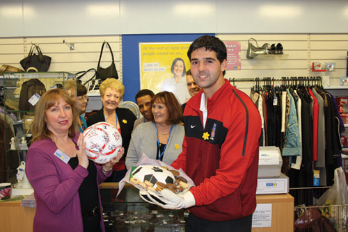 Julian Speroni with the team of Marie Curie Cancer Care shop volunteers.