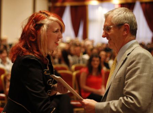 Photograph:  Chair of Governors, Mr Childs, presenting a certificate to one of the Warlingham School sixth formers.