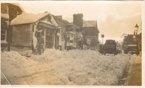 Outside No. 33 High Street, Caterham-on-the-Hill during the winter of 1946-7.