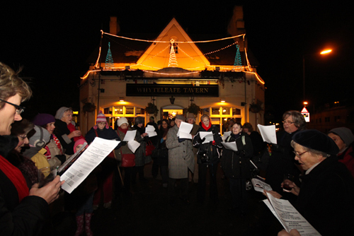 'Luke's Larks' from St. Lukes Church in Whyteleafe singing carols outside the Whyteleafe Tavern.  Photograph by Jon Harrison, www.localeventphotos.co.uk