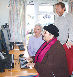 'Get Digital' Tutor Steve Collis introduces Warlingham residents Peggy Knock and Kathleen Sailes to IT.