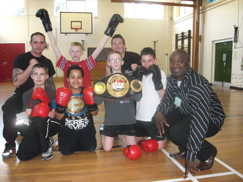 Former Light Middleweight Champion Wayne Alexander with students from Oasis Academy, Coulsdon.