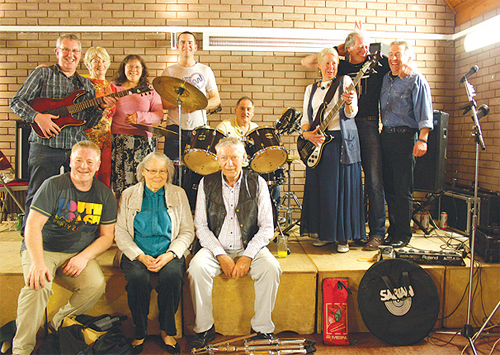 COAT members join the band on stage at the end of the fundraising dance at the Sacred Heart Church Hall.