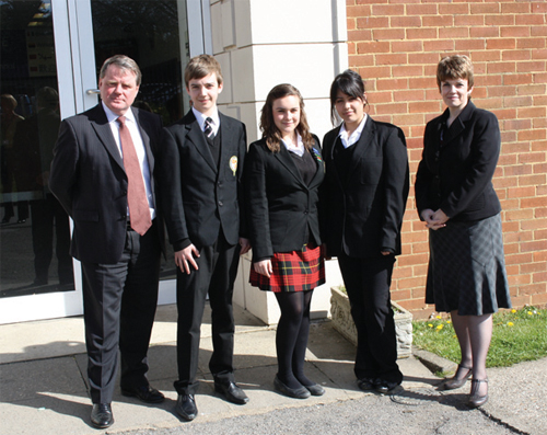 John Troake, Chairman of Governors and Caroline Longhurst, head teacher of de Stafford School with students (from left) Jack Gillam, Hazel McRae and Atusa Habibian. Photo by Adam Willmott