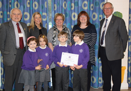 Rotary members Terry Servant (left) and Mike Smith with (from left) Lucie Bennion, Linden Homes, head teacher, Julie Leader and Gail Fraser with pupils from St. Peter and St. Paul School. Photo by Adam Willmott