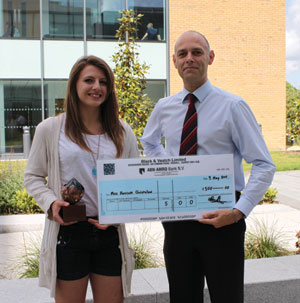 Harriett Christelow, with her winning trophy design being congratulated by Matthew Nott, Black & Veatch Managing Director. 