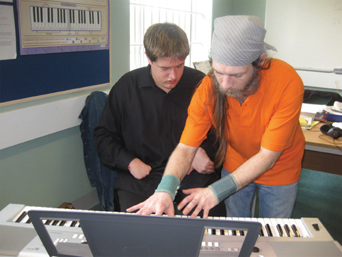 An Orpheus student and prisoner from High Down working together on the project.