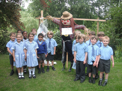 Essendene School pupils with their winning scarecrow, 'Martha'. 