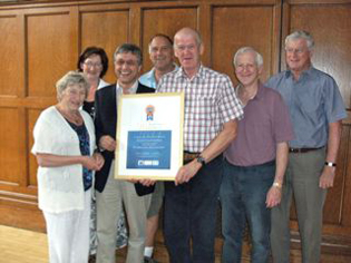 Members of the ABC Caterham 'Shabby 2 Smart' team with their award, from left, Anne Bell, Cllr. Sally Marks, Random Greenway, Andy Parr, Nigel Wilkinson, Chris Windridge and Bill Ridley. 