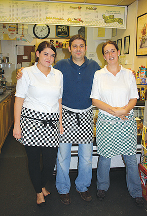 Ian Bristow with his assistants Amelia (left) and Poppy.