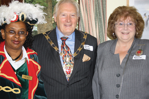 Chairman of Tandridge District Council, Brian Perkins with his wife Sonia and the Caterham Town Crier, Sonia Hunt. Photograph by Stephanie Bourazanis.