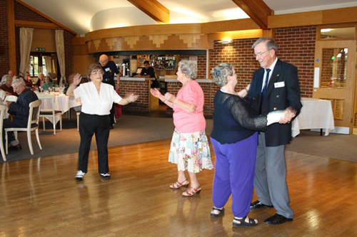 Rotarian Mike Miller has a twirl on the dancefloor with Eileen Dickson.