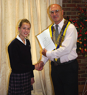 President of Caterham Rotary Club, David Mole, presents Rosie Cardoe with her award.