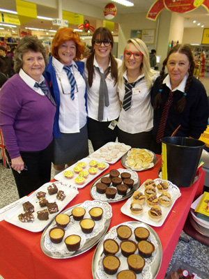 The Morrison's team with their home-made cakes.  Photo by Shelley Filippi.