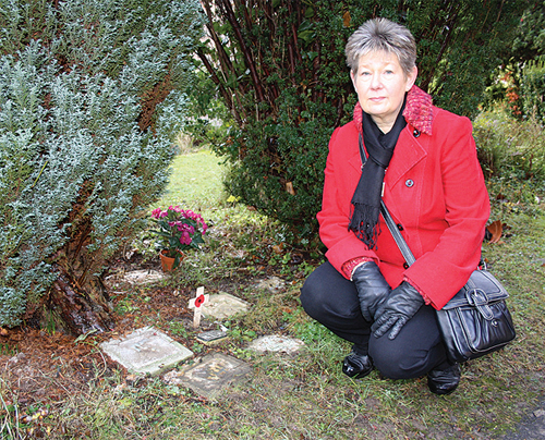 Norma Haimes by the memorials to her family members whose plaques were amongst those stolen in November.