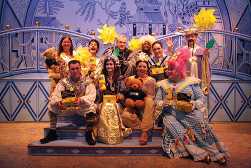 Marie Curie Volunteer Fundraiser, Karen Green (top left) with the cast of Alladin.  Photograph by David Cook