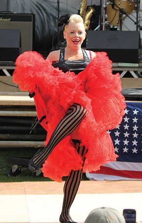 A Can Can dancer entertains the crowd at last year’s De- Fest music festival. Photo by Jon Harrison.