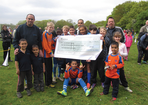 The Pumas with the cheque for £600 for a new kit donated by Glen O’Dwyer of Computer Solutions.