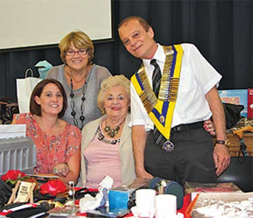 The new President of Caterham Rotary Club, Peter Georgiades, with some lady stallholders at the Extravaganza.