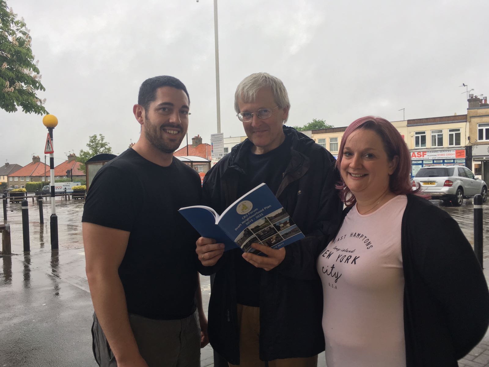 Cllr. Geoff Duck, centre, shows the Neighbourhood Plan document to Tesco shoppers, Marc Wimble and Sarah Green who both live in the CR3 consultation area.